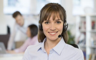 Portrait of Businesswoman in the office on the phone, headset